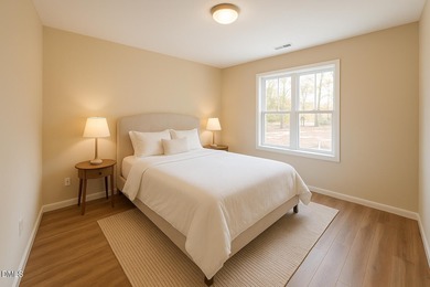Welcome home to this charming three-bedroom, two-bath ranch on River Golf and Country Club at Lake Royale in North Carolina - for sale on GolfHomes.com, golf home, golf lot