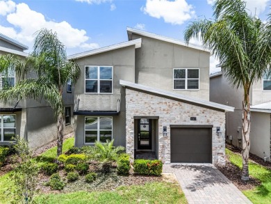 Step into resort-style living at 661 Drop Shot Drive, a on The Oasis Club at Champions Gate in Florida - for sale on GolfHomes.com, golf home, golf lot