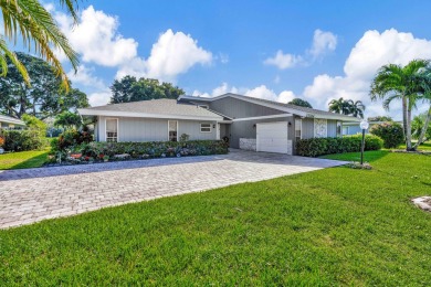 This stunning home boasts a bright and expansive great room with on Eastpointe Country Club in Florida - for sale on GolfHomes.com, golf home, golf lot