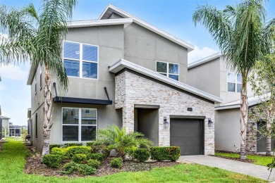 Step into resort-style living at 661 Drop Shot Drive, a on The Oasis Club at Champions Gate in Florida - for sale on GolfHomes.com, golf home, golf lot