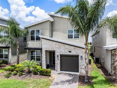 Step into resort-style living at 661 Drop Shot Drive, a on The Oasis Club at Champions Gate in Florida - for sale on GolfHomes.com, golf home, golf lot