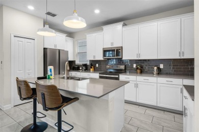 Step into resort-style living at 661 Drop Shot Drive, a on The Oasis Club at Champions Gate in Florida - for sale on GolfHomes.com, golf home, golf lot