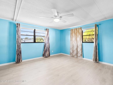 Welcome to your dream home in Barefoot Bay! This spacious on Barefoot Bay Golf Course in Florida - for sale on GolfHomes.com, golf home, golf lot