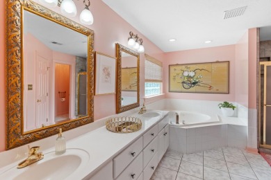 Full of charm and nestled in a quiet cul-de-sac, this 4-bedroom on West Lake Country Club in Georgia - for sale on GolfHomes.com, golf home, golf lot