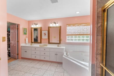 Full of charm and nestled in a quiet cul-de-sac, this 4-bedroom on West Lake Country Club in Georgia - for sale on GolfHomes.com, golf home, golf lot
