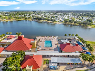 Welcome to your dream home in Barefoot Bay! This spacious on Barefoot Bay Golf Course in Florida - for sale on GolfHomes.com, golf home, golf lot