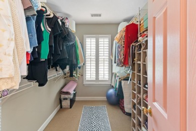 Full of charm and nestled in a quiet cul-de-sac, this 4-bedroom on West Lake Country Club in Georgia - for sale on GolfHomes.com, golf home, golf lot