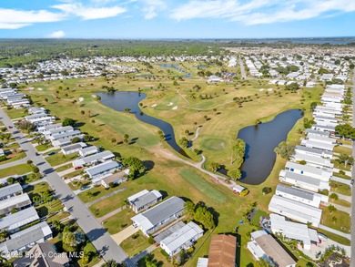 Welcome to your dream home in Barefoot Bay! This spacious on Barefoot Bay Golf Course in Florida - for sale on GolfHomes.com, golf home, golf lot