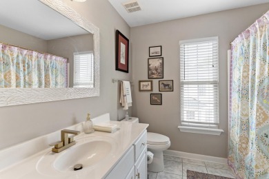 Full of charm and nestled in a quiet cul-de-sac, this 4-bedroom on West Lake Country Club in Georgia - for sale on GolfHomes.com, golf home, golf lot