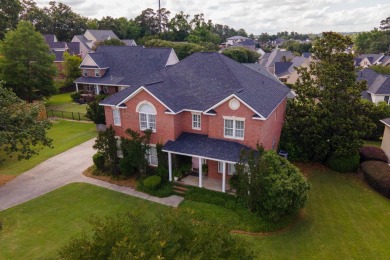 Full of charm and nestled in a quiet cul-de-sac, this 4-bedroom on West Lake Country Club in Georgia - for sale on GolfHomes.com, golf home, golf lot