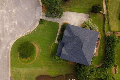 Full of charm and nestled in a quiet cul-de-sac, this 4-bedroom on West Lake Country Club in Georgia - for sale on GolfHomes.com, golf home, golf lot