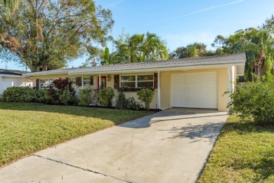 This beautifully updated three-bedroom, two-bathroom pool home on Largo Golf Course in Florida - for sale on GolfHomes.com, golf home, golf lot