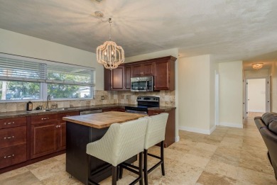 This beautifully updated three-bedroom, two-bathroom pool home on Largo Golf Course in Florida - for sale on GolfHomes.com, golf home, golf lot