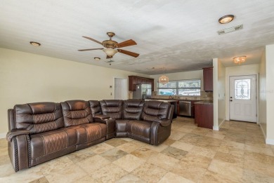 This beautifully updated three-bedroom, two-bathroom pool home on Largo Golf Course in Florida - for sale on GolfHomes.com, golf home, golf lot