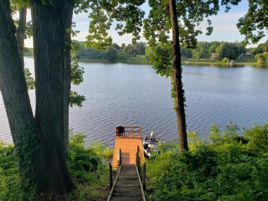 Welcome to this picturesque lakeside retreat, nestled on the on Spruce Ridge Golf Club in Michigan - for sale on GolfHomes.com, golf home, golf lot