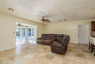 This beautifully updated three-bedroom, two-bathroom pool home on Largo Golf Course in Florida - for sale on GolfHomes.com, golf home, golf lot