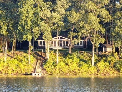 Welcome to this picturesque lakeside retreat, nestled on the on Spruce Ridge Golf Club in Michigan - for sale on GolfHomes.com, golf home, golf lot