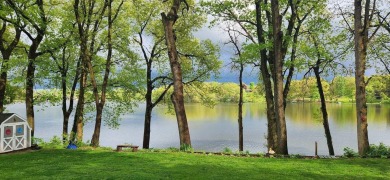 Welcome to this picturesque lakeside retreat, nestled on the on Spruce Ridge Golf Club in Michigan - for sale on GolfHomes.com, golf home, golf lot