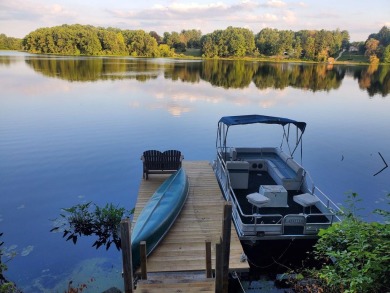 Welcome to this picturesque lakeside retreat, nestled on the on Spruce Ridge Golf Club in Michigan - for sale on GolfHomes.com, golf home, golf lot