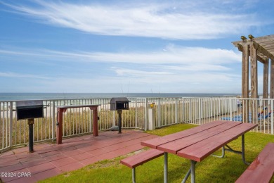 Discover Your Perfect Beachfront Escape! This stunning on Holiday Golf Club in Florida - for sale on GolfHomes.com, golf home, golf lot