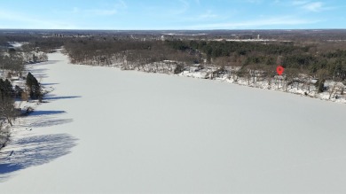 Welcome to this picturesque lakeside retreat, nestled on the on Spruce Ridge Golf Club in Michigan - for sale on GolfHomes.com, golf home, golf lot