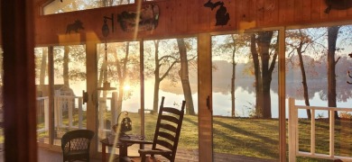 Welcome to this picturesque lakeside retreat, nestled on the on Spruce Ridge Golf Club in Michigan - for sale on GolfHomes.com, golf home, golf lot