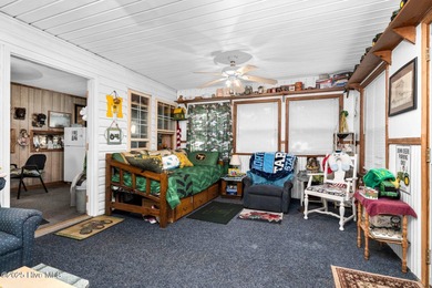 Escape to Lake Royale with this unique weekend retreat at 106 & on River Golf and Country Club at Lake Royale in North Carolina - for sale on GolfHomes.com, golf home, golf lot