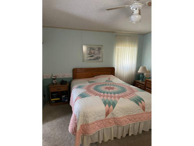 This spacious and move-in ready singlewide home, situated on lot on Anglers Green Golf Course in Florida - for sale on GolfHomes.com, golf home, golf lot