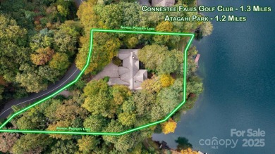 Situated on beautiful Lake Ticoa in the gated community of on Connestee Falls Golf Club in North Carolina - for sale on GolfHomes.com, golf home, golf lot