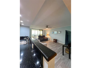Welcome to this exquisitely updated 3-bedroom, 2-bath top-floor on Feather Sound Country Club in Florida - for sale on GolfHomes.com, golf home, golf lot