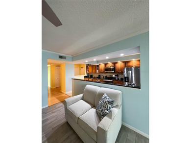 Welcome to this exquisitely updated 3-bedroom, 2-bath top-floor on Feather Sound Country Club in Florida - for sale on GolfHomes.com, golf home, golf lot