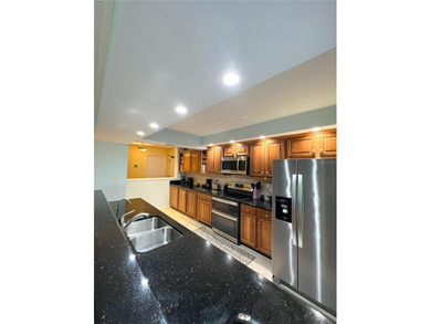 Welcome to this exquisitely updated 3-bedroom, 2-bath top-floor on Feather Sound Country Club in Florida - for sale on GolfHomes.com, golf home, golf lot