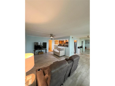 Welcome to this exquisitely updated 3-bedroom, 2-bath top-floor on Feather Sound Country Club in Florida - for sale on GolfHomes.com, golf home, golf lot