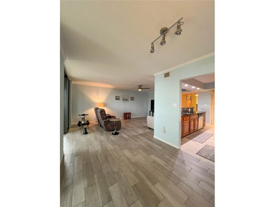 Welcome to this exquisitely updated 3-bedroom, 2-bath top-floor on Feather Sound Country Club in Florida - for sale on GolfHomes.com, golf home, golf lot