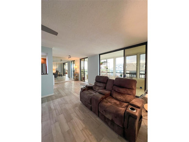 Welcome to this exquisitely updated 3-bedroom, 2-bath top-floor on Feather Sound Country Club in Florida - for sale on GolfHomes.com, golf home, golf lot