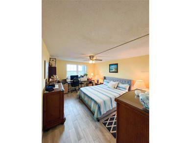 Welcome to this exquisitely updated 3-bedroom, 2-bath top-floor on Feather Sound Country Club in Florida - for sale on GolfHomes.com, golf home, golf lot