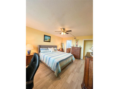 Welcome to this exquisitely updated 3-bedroom, 2-bath top-floor on Feather Sound Country Club in Florida - for sale on GolfHomes.com, golf home, golf lot