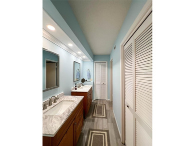 Welcome to this exquisitely updated 3-bedroom, 2-bath top-floor on Feather Sound Country Club in Florida - for sale on GolfHomes.com, golf home, golf lot