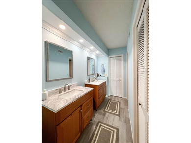 Welcome to this exquisitely updated 3-bedroom, 2-bath top-floor on Feather Sound Country Club in Florida - for sale on GolfHomes.com, golf home, golf lot