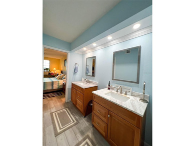 Welcome to this exquisitely updated 3-bedroom, 2-bath top-floor on Feather Sound Country Club in Florida - for sale on GolfHomes.com, golf home, golf lot