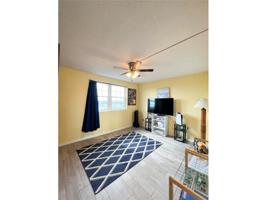 Welcome to this exquisitely updated 3-bedroom, 2-bath top-floor on Feather Sound Country Club in Florida - for sale on GolfHomes.com, golf home, golf lot