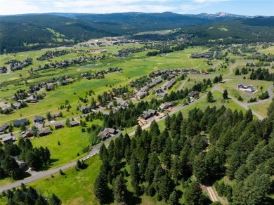 This charming log home, nestled in the trees and perched above on Big Sky of Montana Golf Course in Montana - for sale on GolfHomes.com, golf home, golf lot