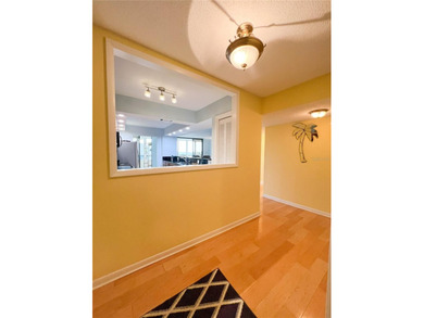 Welcome to this exquisitely updated 3-bedroom, 2-bath top-floor on Feather Sound Country Club in Florida - for sale on GolfHomes.com, golf home, golf lot