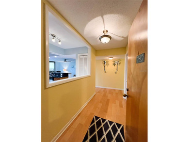 Welcome to this exquisitely updated 3-bedroom, 2-bath top-floor on Feather Sound Country Club in Florida - for sale on GolfHomes.com, golf home, golf lot