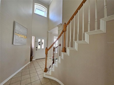 Set within the beautifully maintained and gated Remington Golf on Remington Golf Club in Florida - for sale on GolfHomes.com, golf home, golf lot