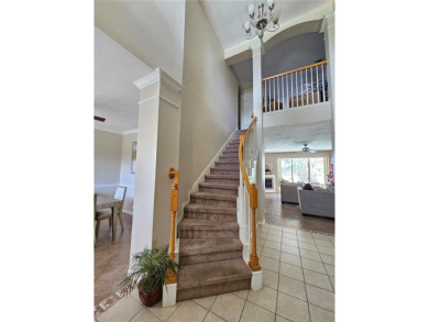 Set within the beautifully maintained and gated Remington Golf on Remington Golf Club in Florida - for sale on GolfHomes.com, golf home, golf lot