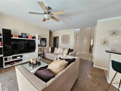 Set within the beautifully maintained and gated Remington Golf on Remington Golf Club in Florida - for sale on GolfHomes.com, golf home, golf lot