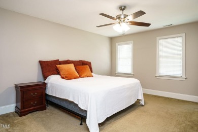 This exceptional property on a private wooded lot in the heart on Devils Ridge Golf Club in North Carolina - for sale on GolfHomes.com, golf home, golf lot