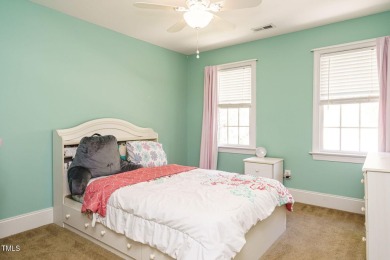 This exceptional property on a private wooded lot in the heart on Devils Ridge Golf Club in North Carolina - for sale on GolfHomes.com, golf home, golf lot
