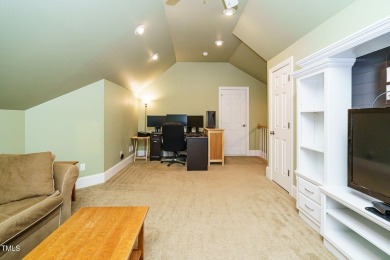 This exceptional property on a private wooded lot in the heart on Devils Ridge Golf Club in North Carolina - for sale on GolfHomes.com, golf home, golf lot